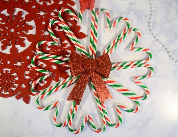Candy Can Wreath tutorial using a sparkly bow
