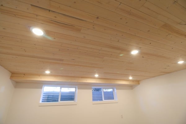 DIY Whitewashed Wood Plank Ceiling in a Basement