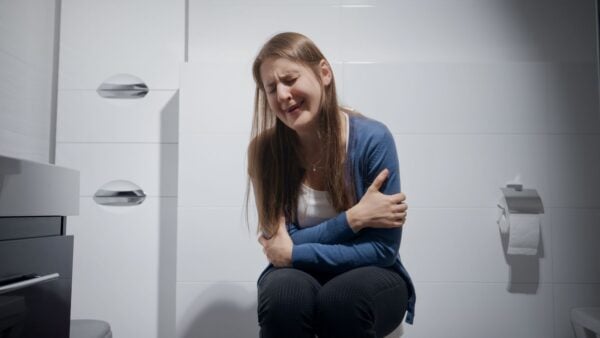 10 bathroom trends to avoid, Upset Woman sitting in Bathroom